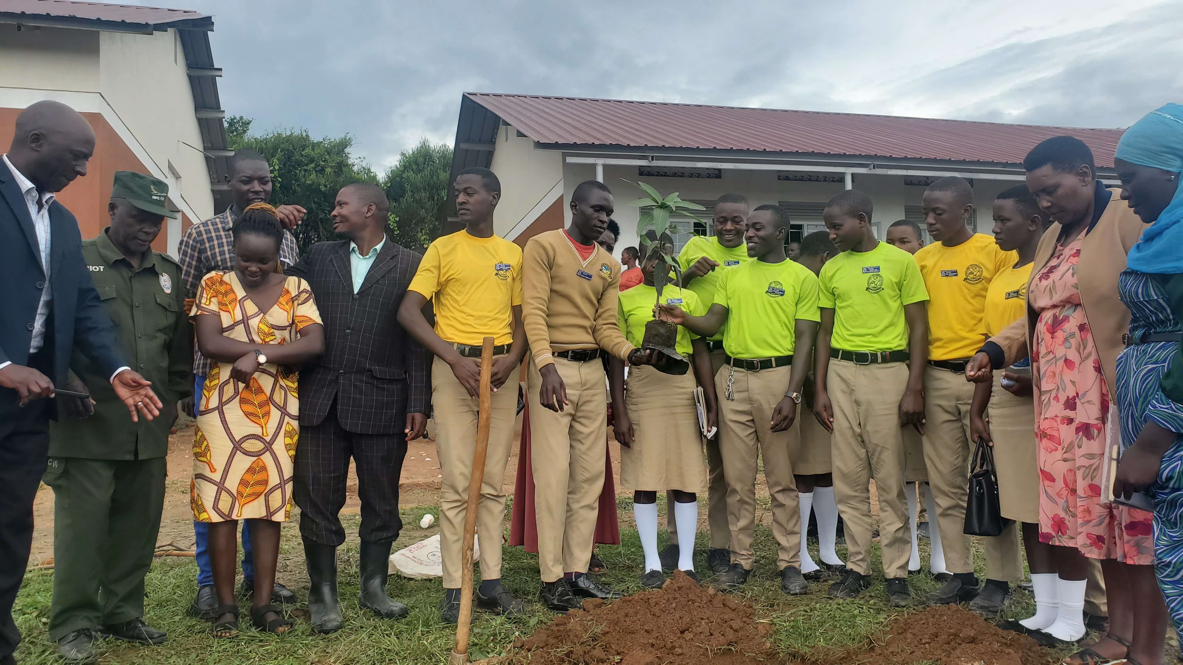 Kasagama secondary school environment club planting trees.