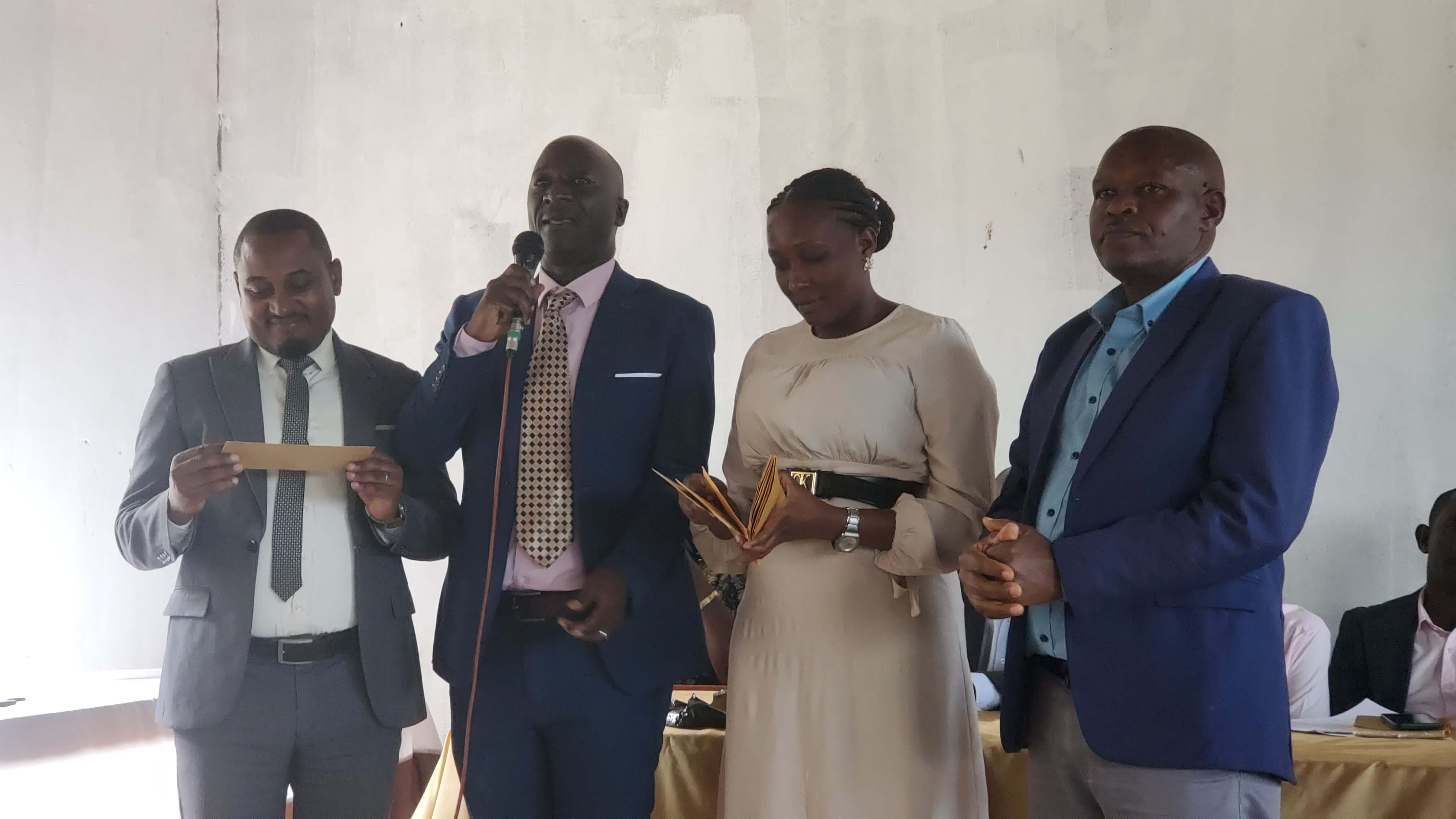 Kasagama Secondary School administration team. Second from left is the Headteacher, Mr. Ssenfuma Herbert Mitti. Third from left is the Deputy Headteacher, Ms. Nakazzi Manjeri.