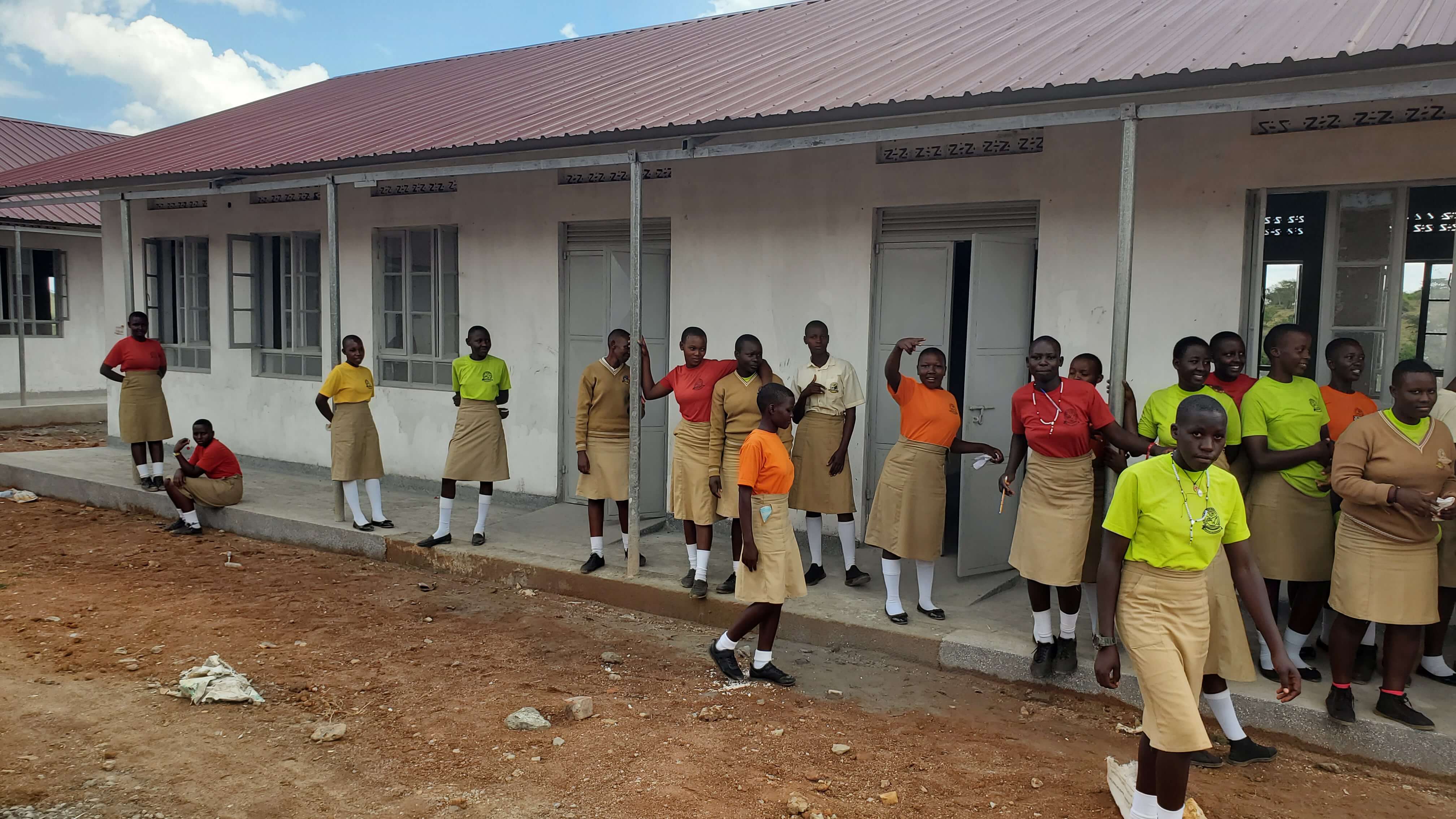 Girls in front of the new classroom block.